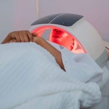 A relaxing LED light therapy treatment at a modern spa in Abuja, Nigeria.